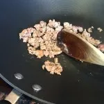 Frying Brown Meat in the pan before adding spices in Boston, MA