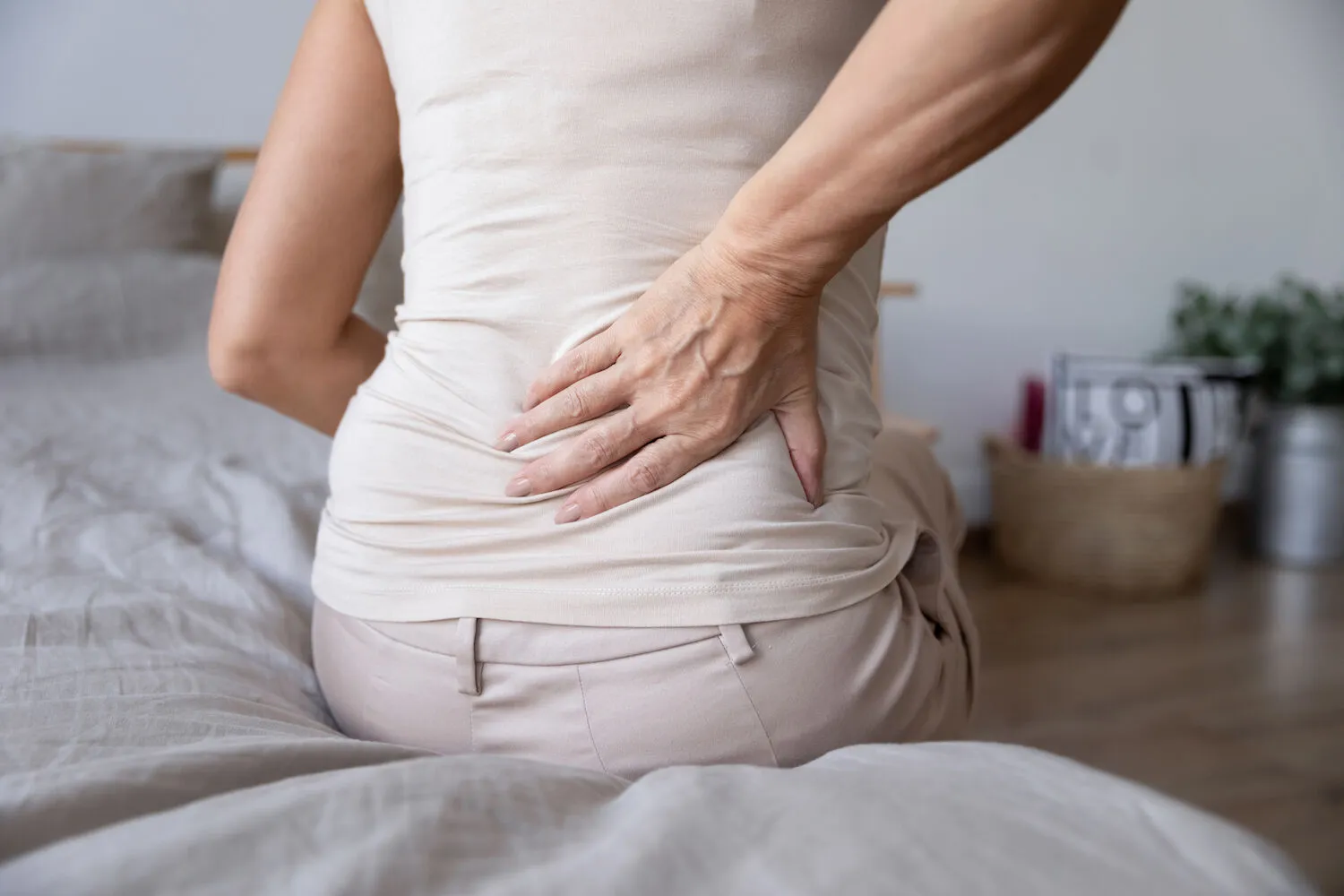 woman having a sciatica after waking up